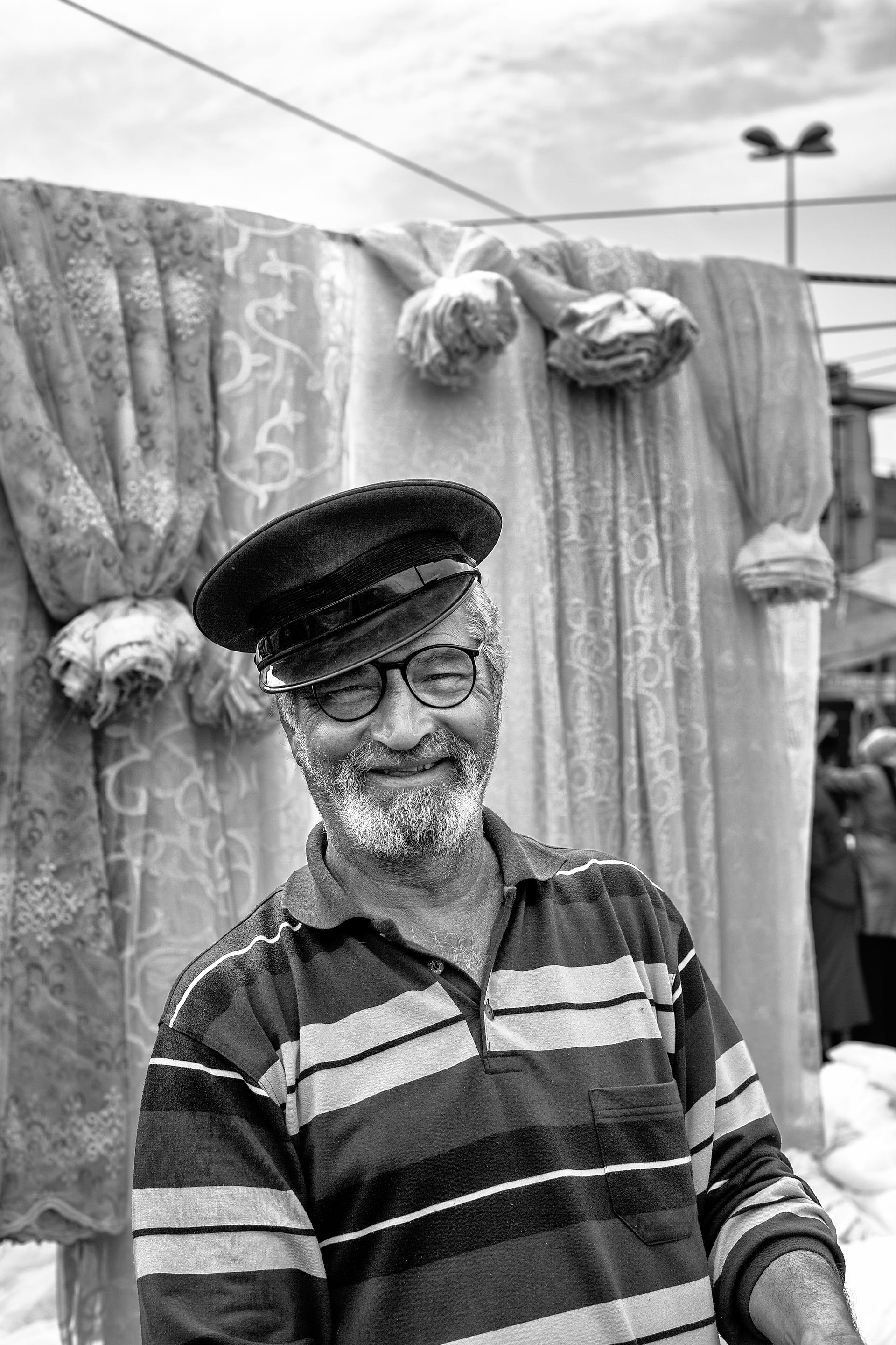 The Curtain Seller's Smile