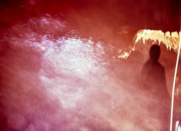 Crimson Haze and Shadow - A solitary form emerges from a dense, atmospheric wash of crimson and violet light, creating a scene that feels more like a fever dream than a physical reality