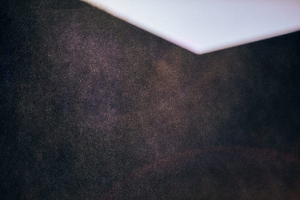 Corner of Quiet - This composition serves as a study in stark minimalism, exploring the profound tension between a vast, textured darkness and a sharp, intruding geometry