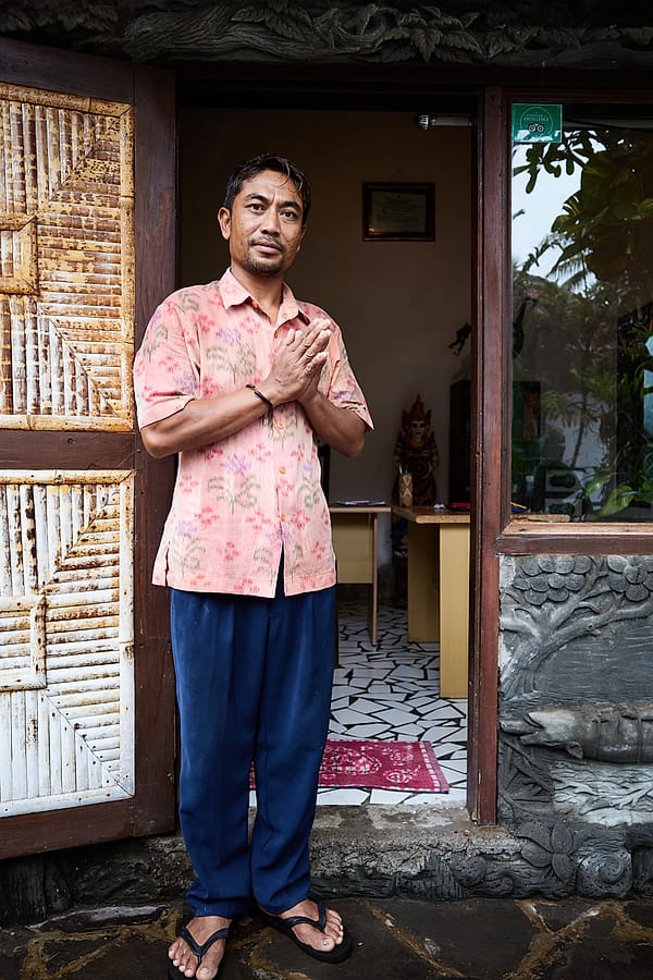 The Host's Gentle Greeting - A profound sense of serene hospitality radiates from the figure standing framed within the rustic wooden doorway